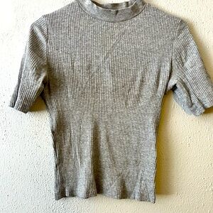 It’s a grey top, simple and beautiful. It is still new and very soft.